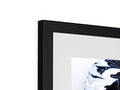 A photograph is made out of white and silver in a blue color frame.