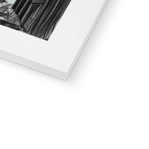 A photo of a picture frame with black and white prints on it