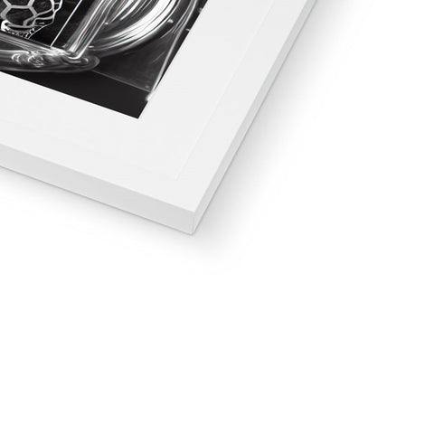 a book filled with many different images of cars is on a white frame