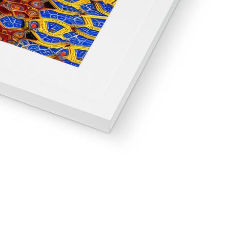A gold picture frame filled with art prints on colorful tile.