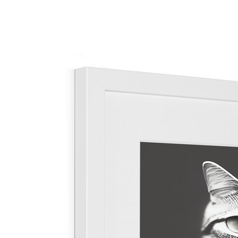 A black and white picture frame sitting on top of a computer screen.