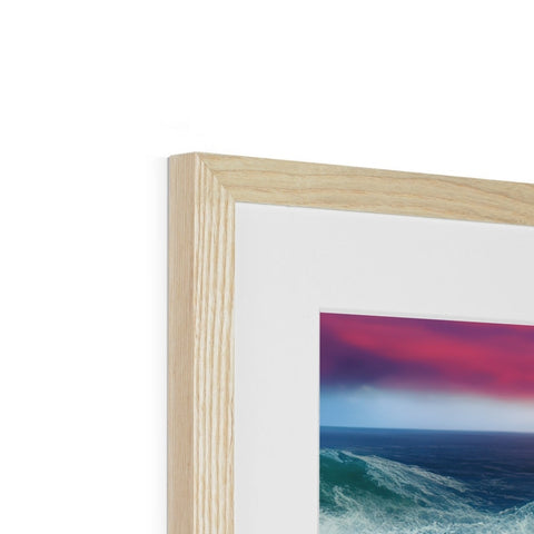 A wooden frame with a beautiful picture framed in it in a white wooden background.
