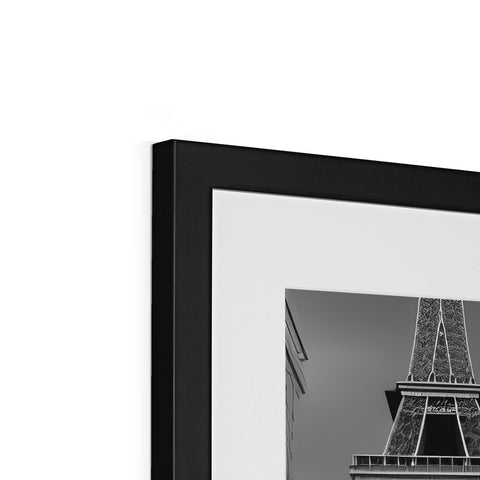 A black and white photo of a picture frame on top of a box.