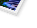 A print of a photo of an imac book in a white square with a clock