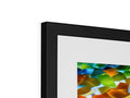 An abstract photograph has a small print on a white metal picture frame.