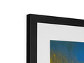A framed picture of an abstract image on a wall with an art print.