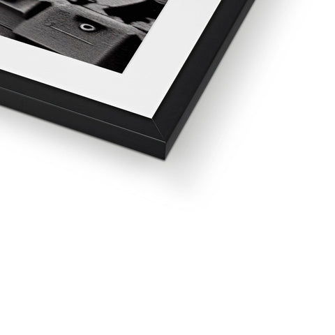 A picture frame on top of a black and white photo tray