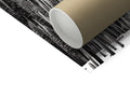 The closeup of a white sheet of paper rolls in front of a brown and black
