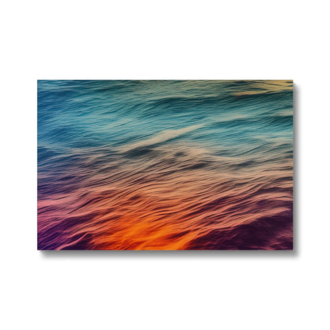 Art print laying on top of a beach with colorful ocean waves.