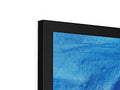 Two flatscreen TV monitors each with multiple images on the screen inside one wall of the