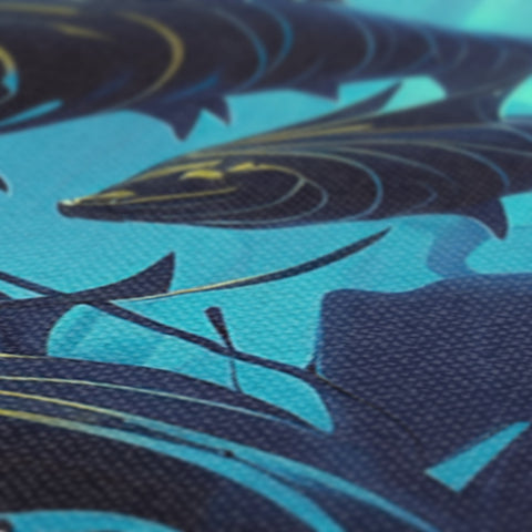 a small blue surfboard covered with gold foil on this black background