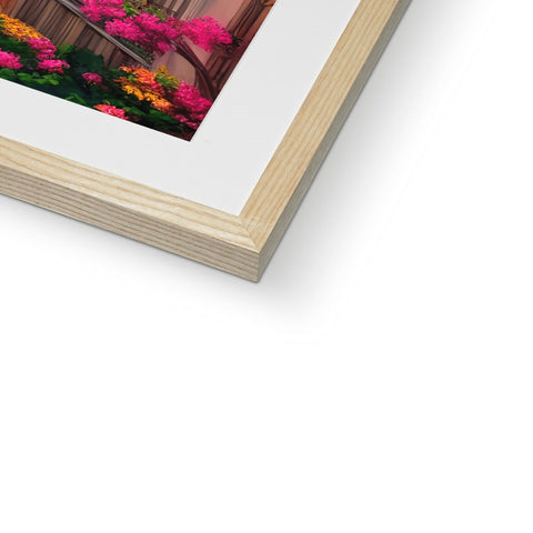 A brown picture frame with a wooden frame and a picture of flowers on it with a