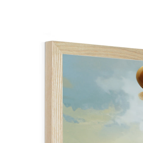 A wooden framed picture of a bird with a mushroom sitting on top.