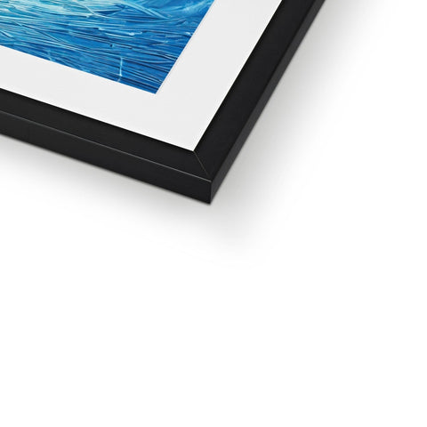 An art print is on a picture frame standing on top of a small table.