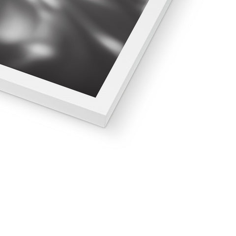 A white photo of an  imac sitting on top of a white photo frame.