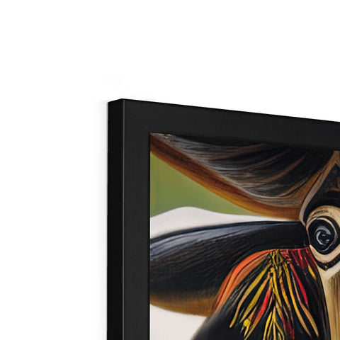 Toucan sitting on top of a picture frame covered in artwork.
