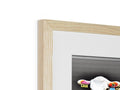 A wooden picture frame with a picture of a Holstein cow sitting on top of a