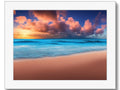 A picture on a white art print of a beach with a very colorful sunset on it
