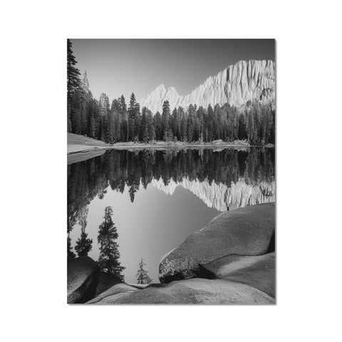 A picture printed in silver onto paper with a landscape set on top of a lake.