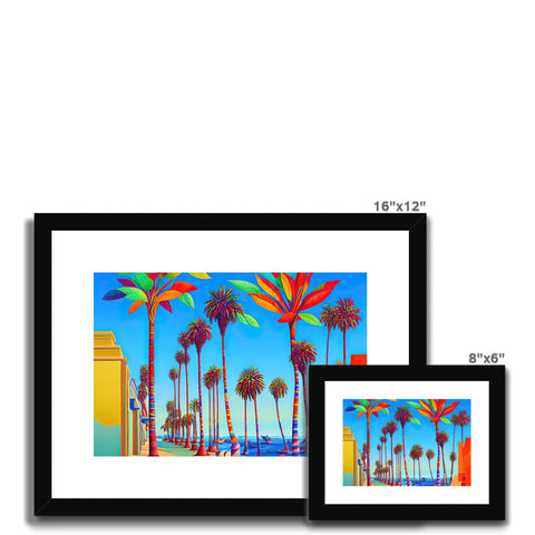 Several art prints and colorful photo frames displayed in a wall with art of palm trees.