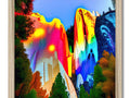There is a rainbow in a small area decorated with art prints of redwoods next to