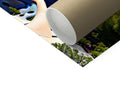 A print picture of a roll of paper next to a yoga mat.
