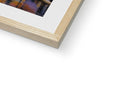 A white picture showing a picture on top of a wood frame.
