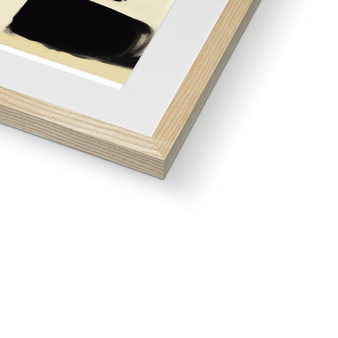 A black picture frame holding a photo with a brown pen on it.