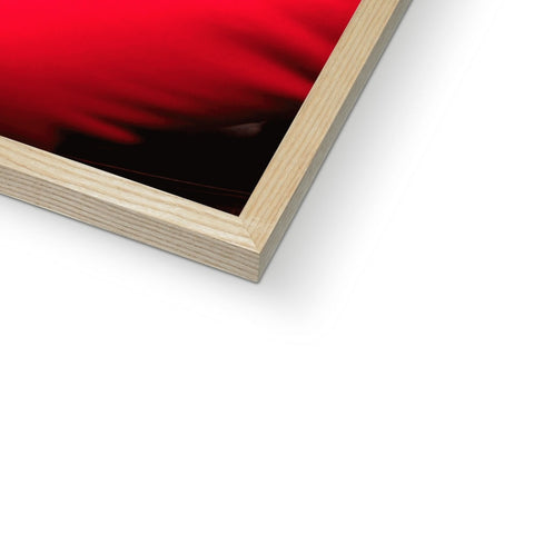 A photo of an image sitting on a wooden frame, surrounded in red paint.