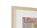 A wooden frame with a photo on a piece of white paper in it.