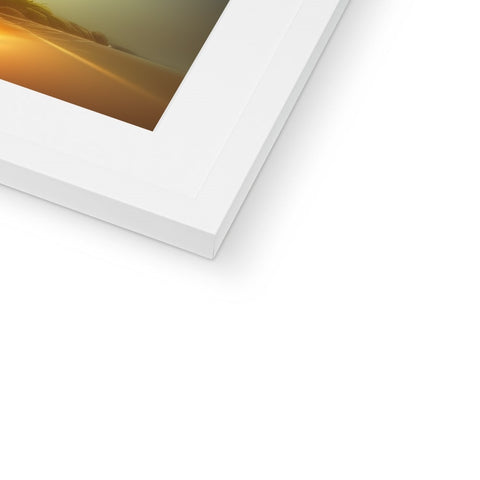 A white photo frame frame with a picture of an imac laying in on top of