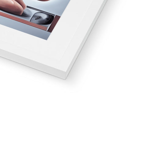 a softcover Polaroid in a frame with a picture of a computer cursor on it