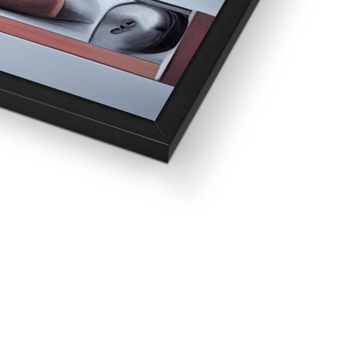 A picture frame with two close-ups of a photo on it's top table.