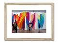 A framed photo of art on a white wall with colored artwork