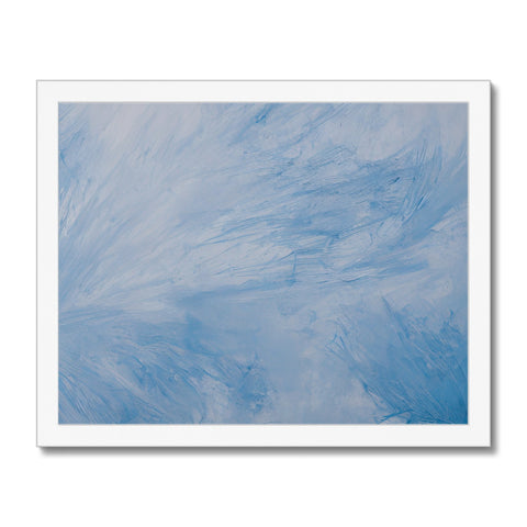 A blue sky sky with a close up of a white picture on a piece of canvas