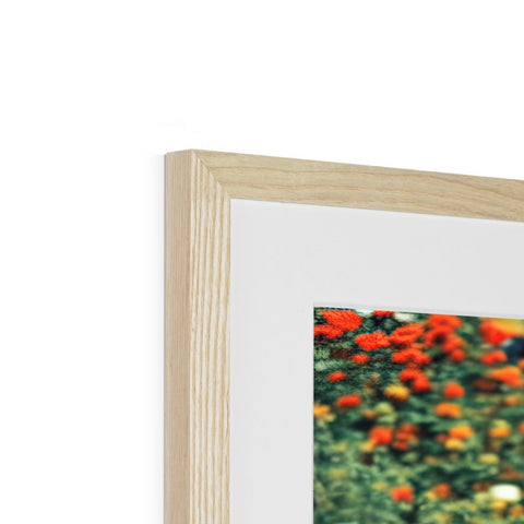 A picture frame with wooden frames in front of it on a white background.