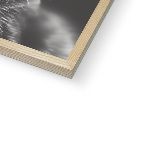 A picture frame in a wood wall with a close up of a photo of water on