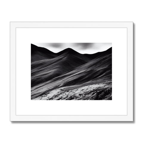 Art print in the desert sitting on a mountain top in the middle of a barren landscape