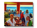 A crowd at a restaurant eating at a place with an art print on a table.