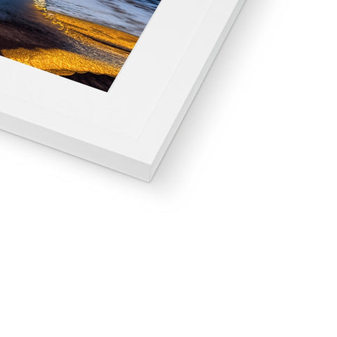 A white photo with a softcover picture and a white picture frame on top of it