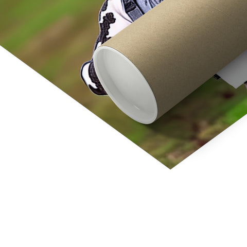 A person uses a roll on a roll of toilet paper.