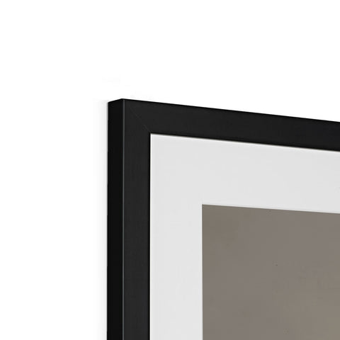 A black and gray picture frame sitting on top of a wall.