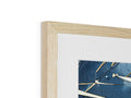 a wooden frame of a beautiful picture lying on top of a table with hanging objects on