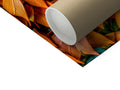 A roll of wrapping paper on a white table with brown paper under it.