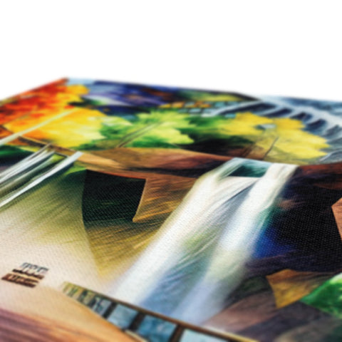 Colorful art prints on paper lined up on a table.