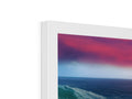 a white picture frame top of an imac print on a wall