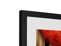 An abstract photograph on a white picture frame holding a wooden piece of art.