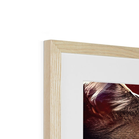 A photo in a picture frame in a wooden frame with a close up of a dog