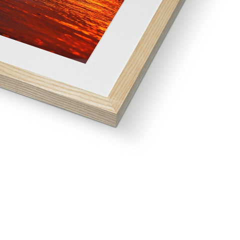 A picture frame with an orange and yellow and red background.