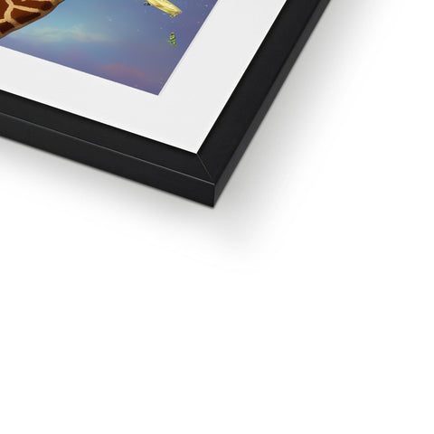 Art print on a photo frame of a giraffe sits on top of a tall white